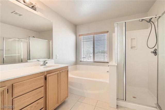 5021 Ropers Rock Ct, Las Vegas, NV 89131 - full bathroom featuring a stall shower, tile patterned floors, vanity, and a garden tub