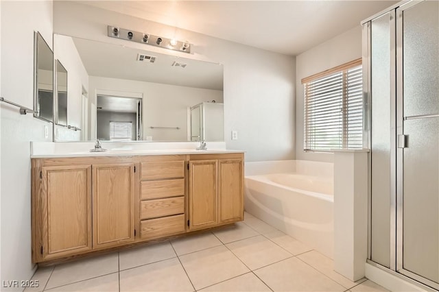 5021 Ropers Rock Ct, Las Vegas, NV 89131 - bathroom featuring a stall shower, tile patterned floors, double vanity, and a bath