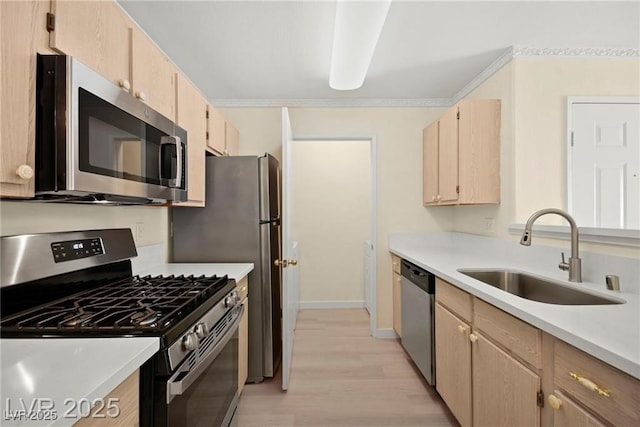 7885 W Flamingo Rd Unit 1131, Las Vegas, NV 89147 - kitchen with appliances with stainless steel finishes, light brown cabinetry, light wood-type flooring, and light countertops