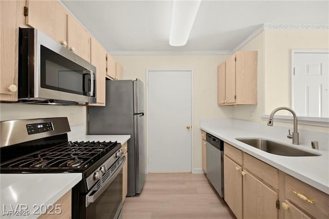 7885 W Flamingo Rd Unit 1131, Las Vegas, NV 89147 - kitchen with stainless steel appliances, light brown cabinets, light wood-type flooring, light countertops, and ornamental molding