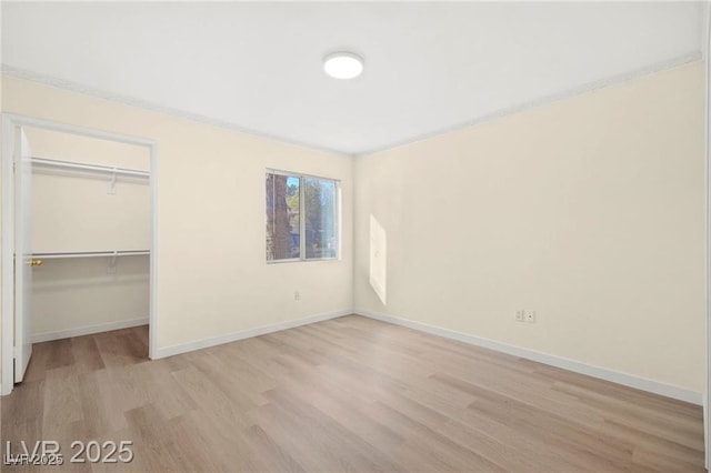 7885 W Flamingo Rd Unit 1131, Las Vegas, NV 89147 - unfurnished bedroom featuring light wood-style floors and a closet