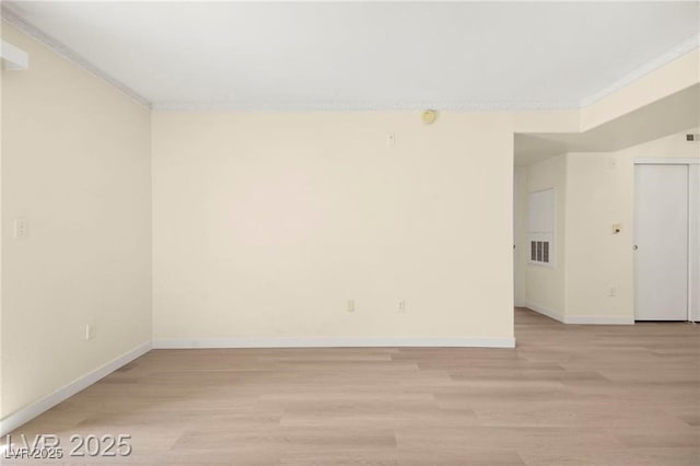 7885 W Flamingo Rd Unit 1131, Las Vegas, NV 89147 - unfurnished room featuring crown molding and light wood-style flooring