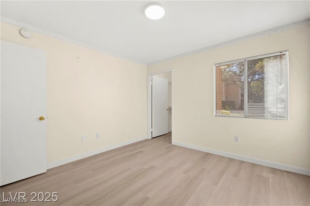7885 W Flamingo Rd Unit 1131, Las Vegas, NV 89147 - empty room featuring light wood-type flooring and crown molding