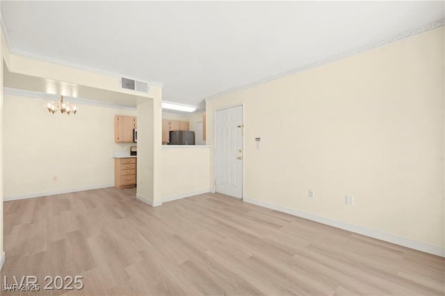 7885 W Flamingo Rd Unit 1131, Las Vegas, NV 89147 - unfurnished living room featuring a chandelier and light wood-style floors