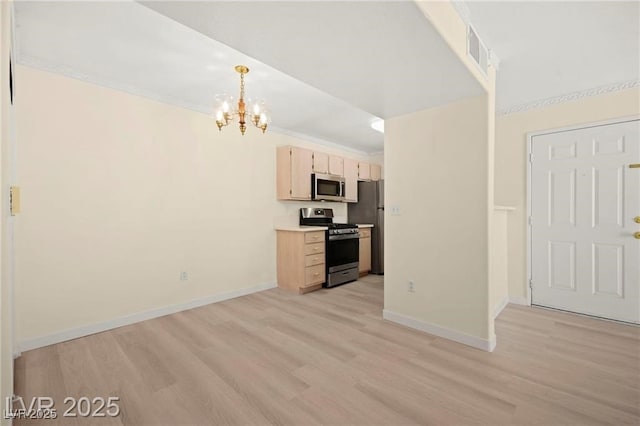 7885 W Flamingo Rd Unit 1131, Las Vegas, NV 89147 - kitchen featuring appliances with stainless steel finishes, a chandelier, light wood finished floors, light countertops, and light brown cabinetry