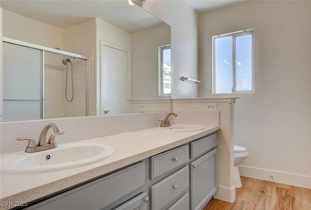 1716 Klamath Falls Way, Las Vegas, NV 89128 - full bathroom with double vanity, tiled shower, and wood finished floors