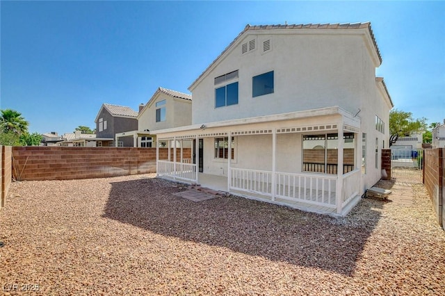 1716 Klamath Falls Way, Las Vegas, NV 89128 - rear view of house featuring stucco siding and a fenced backyard