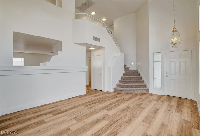 1716 Klamath Falls Way, Las Vegas, NV 89128 - entryway featuring a high ceiling, stairs, a chandelier, wood finished floors, and recessed lighting