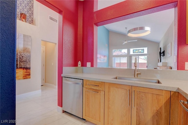 1910 Coyote Pass Way, Henderson, NV 89012 - kitchen with dishwasher, lofted ceiling, light marble finish floors, light countertops, and ceiling fan
