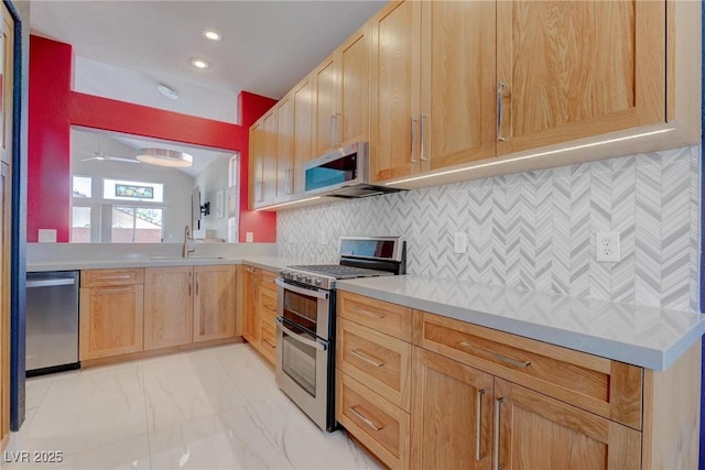 1910 Coyote Pass Way, Henderson, NV 89012 - kitchen featuring appliances with stainless steel finishes, light brown cabinets, light countertops, decorative backsplash, and light marble finish flooring