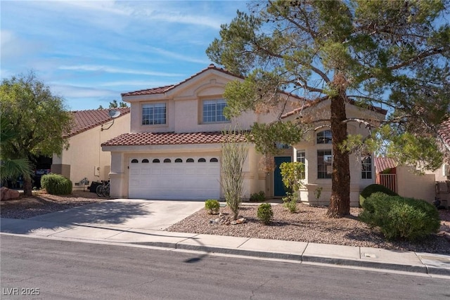 1910 Coyote Pass Way, Henderson, NV 89012 - mediterranean / spanish house with a tile roof, driveway, stucco siding, and a garage