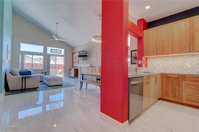 1910 Coyote Pass Way, Henderson, NV 89012 - kitchen with dishwasher, light brown cabinets, open floor plan, vaulted ceiling, and ceiling fan