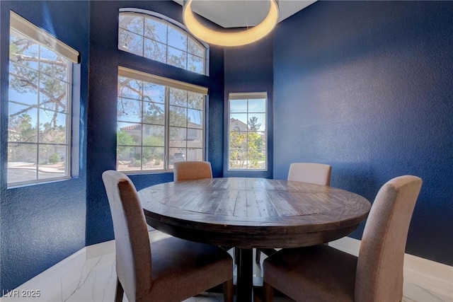 1910 Coyote Pass Way, Henderson, NV 89012 - dining room with a textured wall and healthy amount of natural light