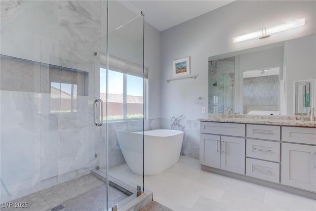 1910 Coyote Pass Way, Henderson, NV 89012 - bathroom with double vanity, a soaking tub, a marble finish shower, tile walls, and tile patterned floors