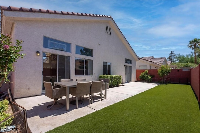 1910 Coyote Pass Way, Henderson, NV 89012 - back of house featuring stucco siding, a patio area, a fenced backyard, and a tile roof