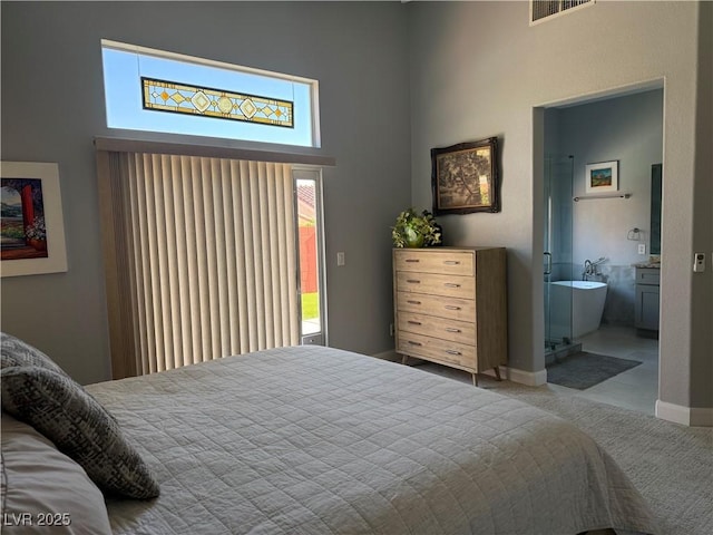 1910 Coyote Pass Way, Henderson, NV 89012 - carpeted bedroom with a towering ceiling, connected bathroom, and access to outside