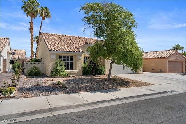920 Serpentina Ave, Las Vegas, NV 89123 - mediterranean / spanish home featuring a tile roof, stucco siding, and driveway