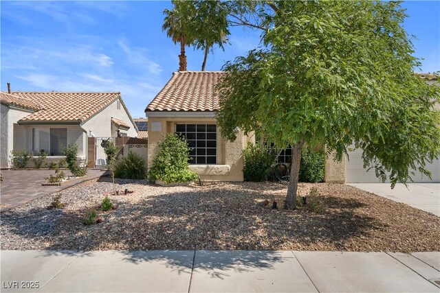 920 Serpentina Ave, Las Vegas, NV 89123 - view of front of home with stucco siding, a tiled roof, a gate, and driveway