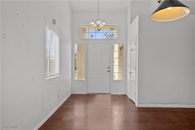 920 Serpentina Ave, Las Vegas, NV 89123 - entrance foyer featuring a chandelier, plenty of natural light, wood finished floors, and a towering ceiling
