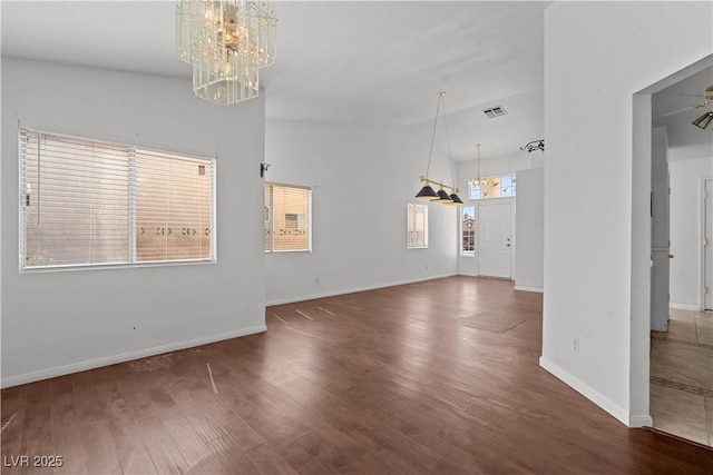 920 Serpentina Ave, Las Vegas, NV 89123 - unfurnished living room featuring a chandelier and wood finished floors