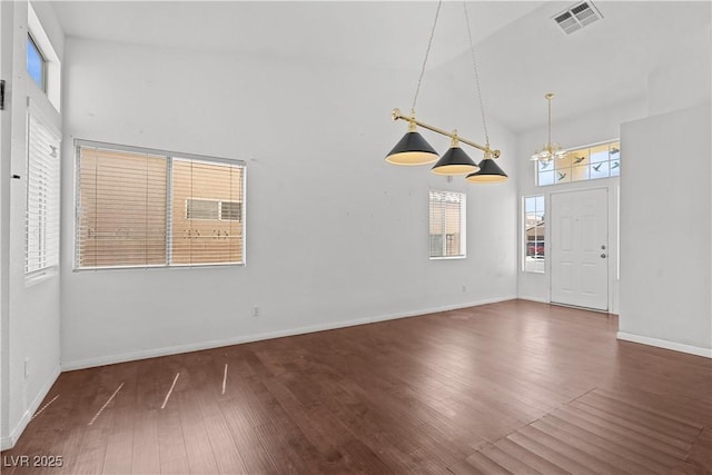 920 Serpentina Ave, Las Vegas, NV 89123 - foyer entrance featuring high vaulted ceiling, wood finished floors, and a chandelier