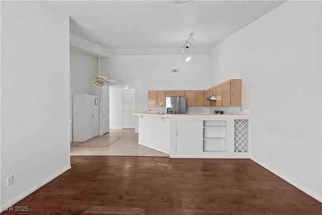 920 Serpentina Ave, Las Vegas, NV 89123 - kitchen with stainless steel fridge with ice dispenser, a towering ceiling, a peninsula, light countertops, and ceiling fan