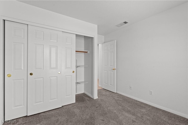 920 Serpentina Ave, Las Vegas, NV 89123 - unfurnished bedroom featuring dark carpet and a closet
