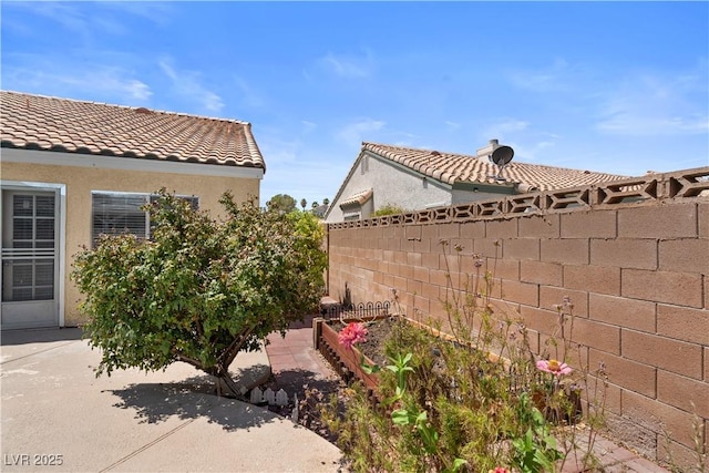 920 Serpentina Ave, Las Vegas, NV 89123 - view of property exterior with a tiled roof and stucco siding