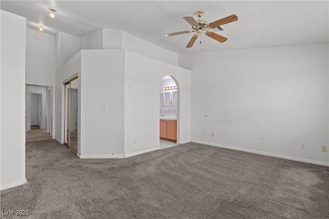 920 Serpentina Ave, Las Vegas, NV 89123 - carpeted spare room with arched walkways, lofted ceiling, and ceiling fan