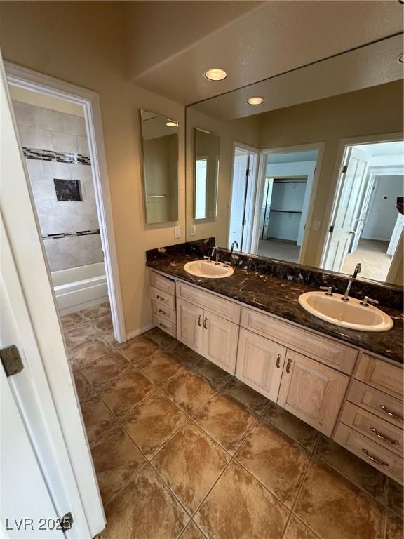 8761 Rainbow Ridge Dr, Las Vegas, NV 89117 - bathroom with double vanity, tile patterned floors, and recessed lighting