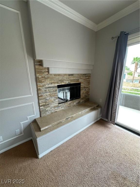 8761 Rainbow Ridge Dr, Las Vegas, NV 89117 - unfurnished living room with carpet, ornamental molding, and a fireplace