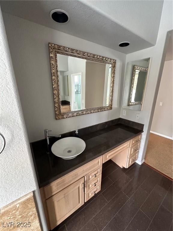 8761 Rainbow Ridge Dr, Las Vegas, NV 89117 - bathroom featuring vanity and baseboards