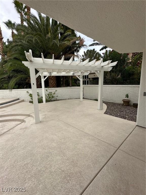 8761 Rainbow Ridge Dr, Las Vegas, NV 89117 - view of patio / terrace featuring a pergola