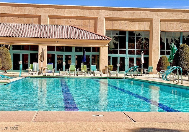 10305 Snyder Ave, Las Vegas, NV 89134 - community pool with a patio area and french doors