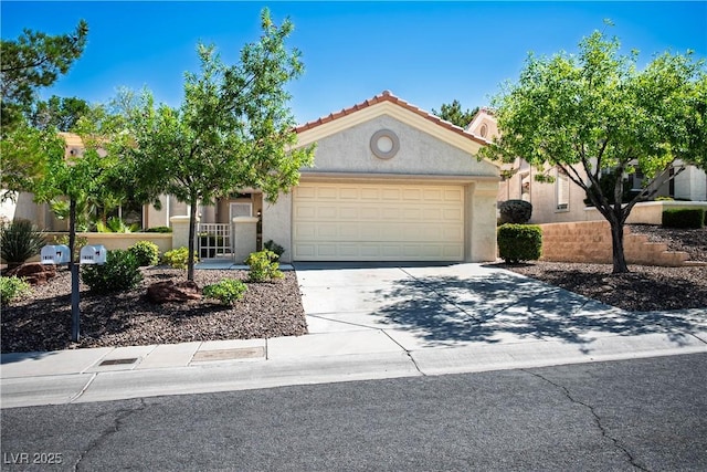 10305 Snyder Ave, Las Vegas, NV 89134 - view of front facade with an attached garage, concrete driveway, stucco siding, and a tiled roof