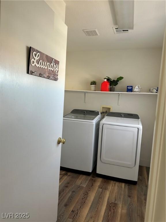 8901 Kingswood Dr, Las Vegas, NV 89147 - washroom featuring separate washer and dryer and wood finished floors