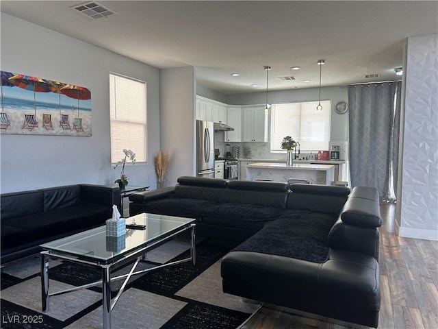 8901 Kingswood Dr, Las Vegas, NV 89147 - living area featuring wood finished floors and recessed lighting