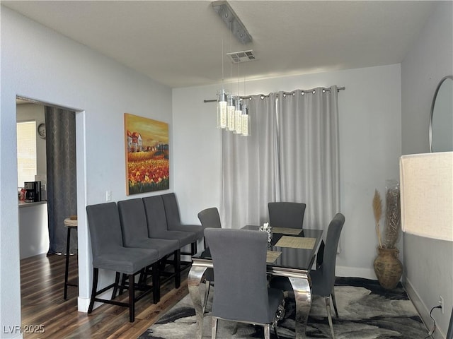 8901 Kingswood Dr, Las Vegas, NV 89147 - dining area featuring wood finished floors and baseboards
