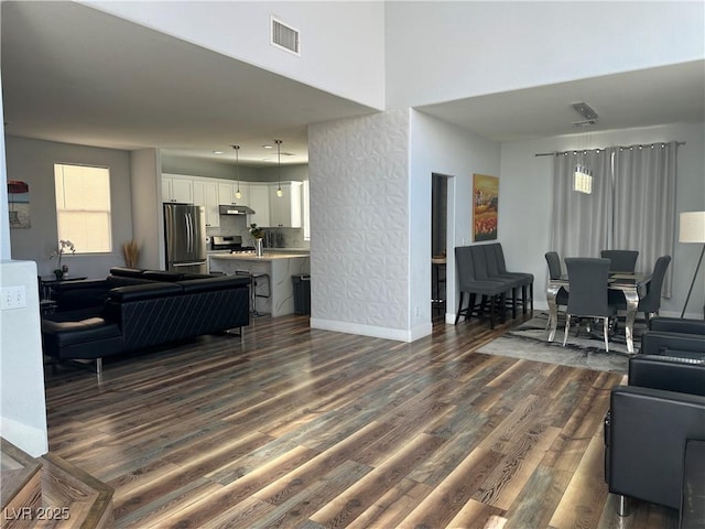 8901 Kingswood Dr, Las Vegas, NV 89147 - living room featuring dark wood-style floors and a high ceiling
