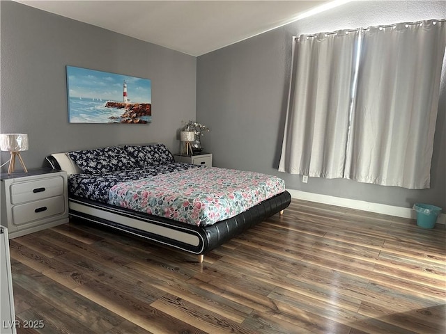 8901 Kingswood Dr, Las Vegas, NV 89147 - bedroom with dark wood-type flooring and baseboards