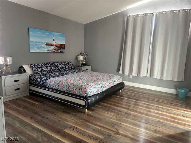 8901 Kingswood Dr, Las Vegas, NV 89147 - bedroom with dark wood finished floors and baseboards