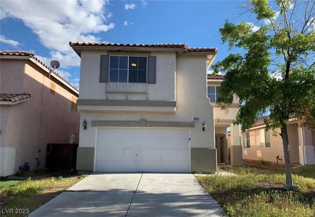 8901 Kingswood Dr, Las Vegas, NV 89147 - view of front of property with a garage, stucco siding, a tiled roof, and concrete driveway