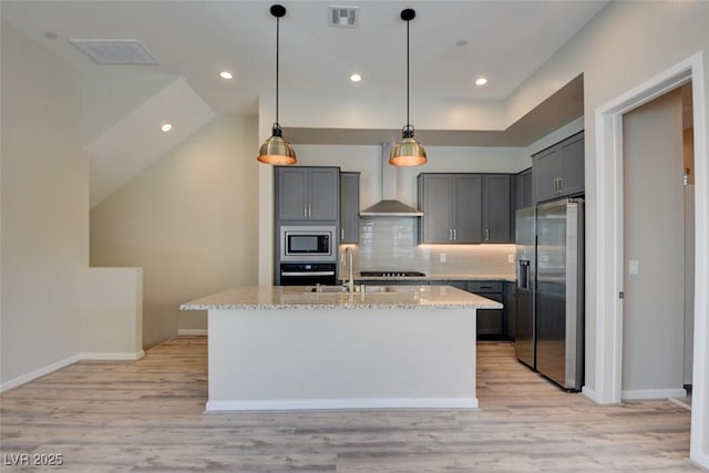 646 Spotted Falcon St, Las Vegas, NV 89138 - kitchen with stainless steel appliances, light stone countertops, gray cabinets, decorative backsplash, and recessed lighting