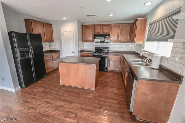 1135 Paradise Mountain Trl, Henderson, NV 89002 - kitchen with black appliances, dark countertops, a kitchen island, and recessed lighting