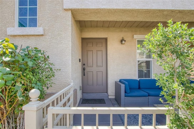 6217 Lapilli Ave, Las Vegas, NV 89139 - view of exterior entry with stucco siding and an outdoor living space