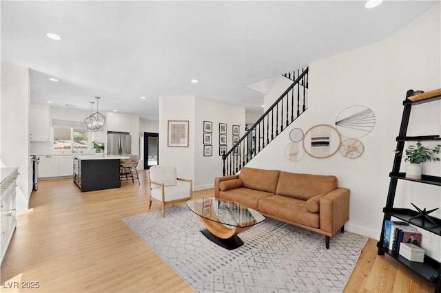 10645 Redwood Grove Ave, Las Vegas, NV 89144 - living area with light wood-type flooring, stairs, and recessed lighting