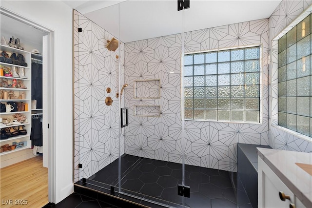 10645 Redwood Grove Ave, Las Vegas, NV 89144 - full bath with a stall shower, tile walls, a walk in closet, and vanity