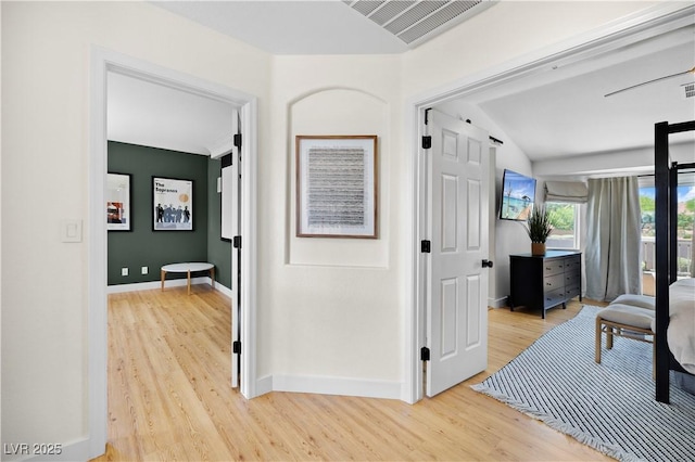 10645 Redwood Grove Ave, Las Vegas, NV 89144 - corridor featuring light wood-style flooring and vaulted ceiling