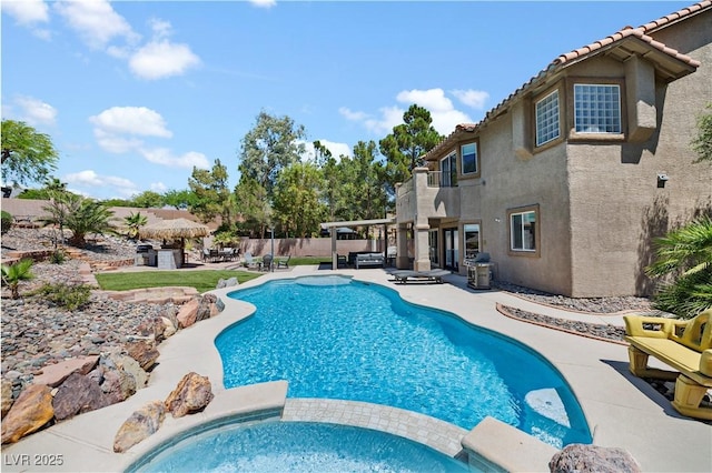 10645 Redwood Grove Ave, Las Vegas, NV 89144 - view of swimming pool with a patio and a pool with connected hot tub