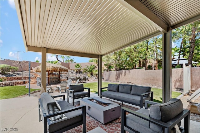 10645 Redwood Grove Ave, Las Vegas, NV 89144 - fenced backyard featuring an outdoor living space with a fire pit and a patio area